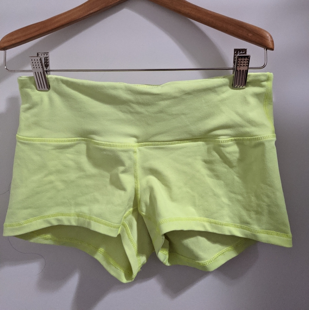 Bright yellow Lululemon booty shorts